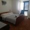Apartmanok és szobák Zavala 2600, Zavala - Szoba kétszemélyes ággyal 3 - erkéllyel és kilátással a tengerre -  