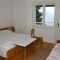 Pokoje Mimice 3194, Mimice - Dvoulůžkový pokoj 5 s manželskou postelí, balkonem a výhledem na moře -  