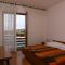 Rooms Mulobedanj 4146, Mulobedanj (Lun) - Quadruple Room 1 with Balcony and Sea View -  