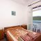 Apartmány a pokoje Polače 4873, Polače - Dvoulůžkový pokoj 4 s manželskou postelí, balkonem a výhledem na moře -  